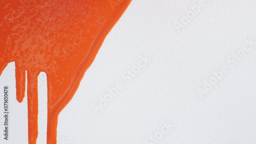bright orange paint flows down from white canvas, abstract background, art minimalism, painting background with colored pigment on textured paper