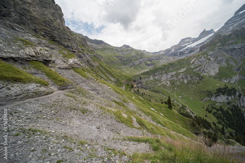 landscape near Oberbärgli, near the oeschinensee in switzerland. Hiking trails lead past the hut, which is a restaurant for hikers. the goods are transported to the hut by helicopter.

 photo