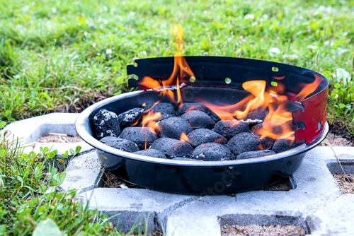 Hot barbecue fire with glowing coals ready to cook for