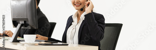 Young Asian woman in business customer service department with phone call headset on white background. 