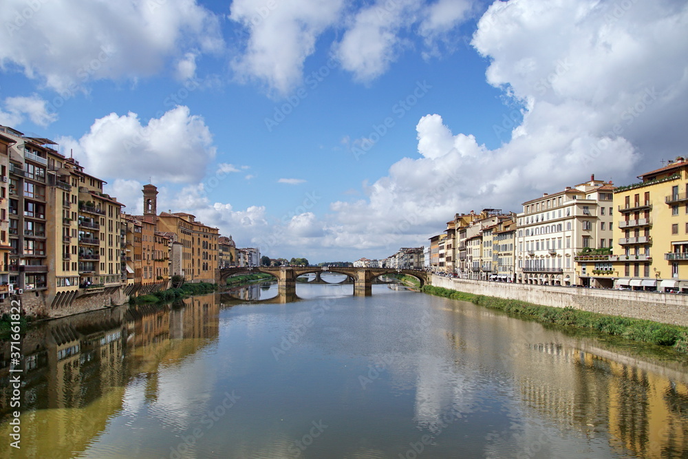 Arno River with Ponte Santa Trinita from Ponte Vecchio. Florence, Italy. The oldest elliptic arch bridge in the world.