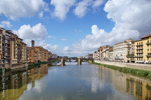 Arno River with Ponte Santa Trinita from Ponte Vecchio. Florence, Italy. The oldest elliptic arch bridge in the world. © otmman