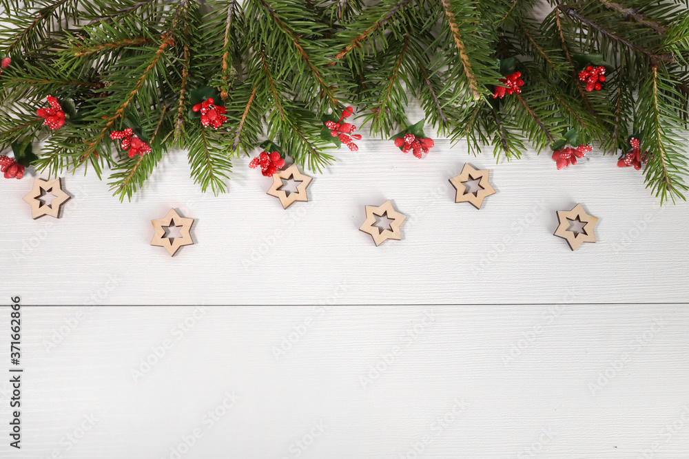 Wide arch shaped Christmas border isolated on white, composed of fresh fir branches and ornaments in red. wooden Christmas stars eco-materials Wide arch shaped Christmas border isolated on white, composed of fresh fir branches and ornaments in red. wooden Christmas stars eco-materials