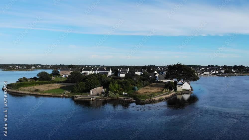 stunning drone fily around Romantic island of Saint-Cado. Discover this islet full of mysteries, connected by a stone bridge and easy of access on foot. blue sky and amazing blue sea stunning drone fily around Romantic island of Saint-Cado. Discover this islet full of mysteries, connected by a stone bridge and easy of access on foot. blue sky and amazing blue sea
