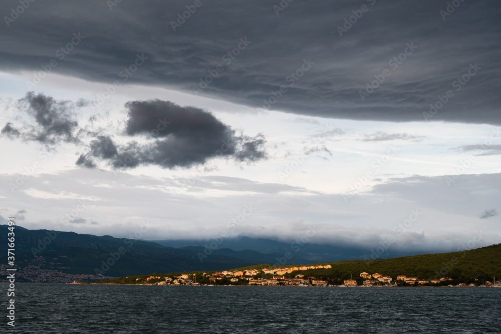 Dark clouds over Klimno town , Krk Island