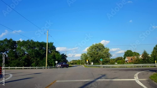 Driving Approaching Rural Stop Sign, Stopping, and Turning Left. Driver Point of View POV Driver Approach Road Sign and Turns.