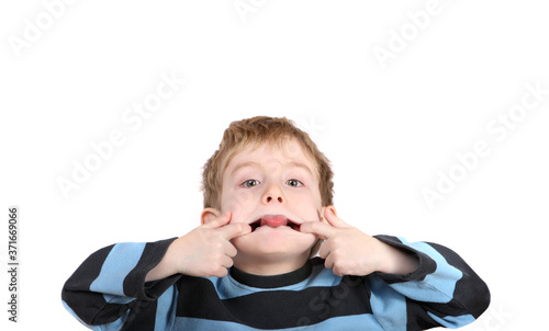 Canvas Print Little boy sticking out his tongue