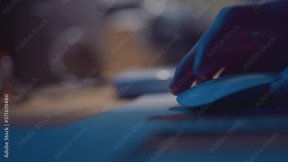 Using computer mouse in office, close up