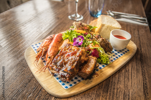 Vibrant prawn squid pork tapas serving platter 