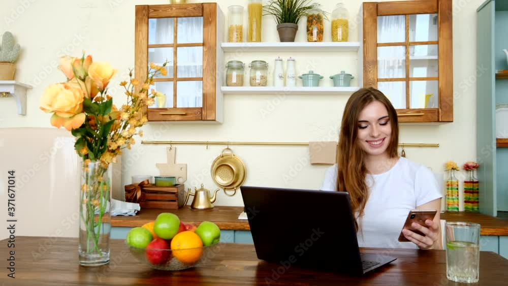 Pretty young woman studying at home, watching lesson online. Pretty young woman studying at home, watching lesson online.