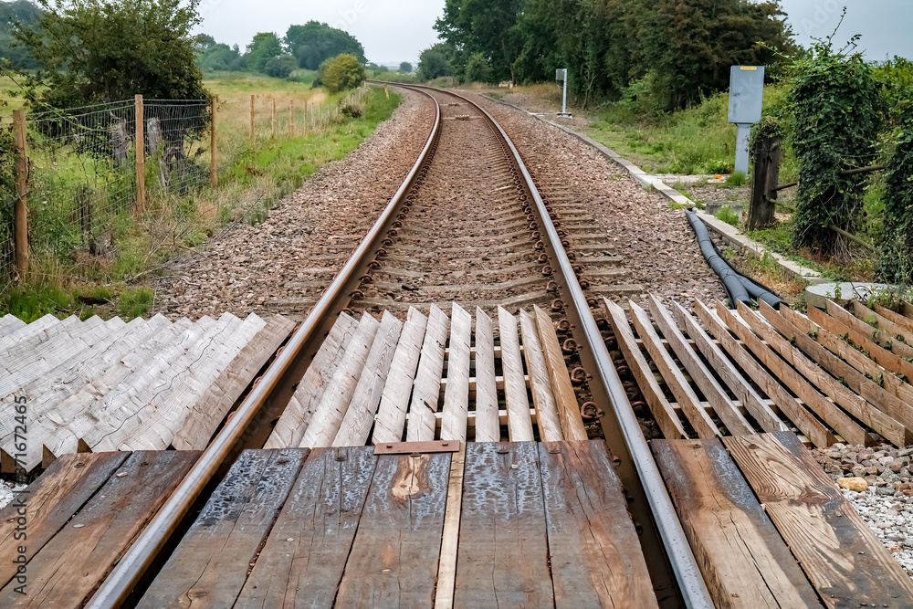Obraz premium A view down the railway track in the Norfolk countryside