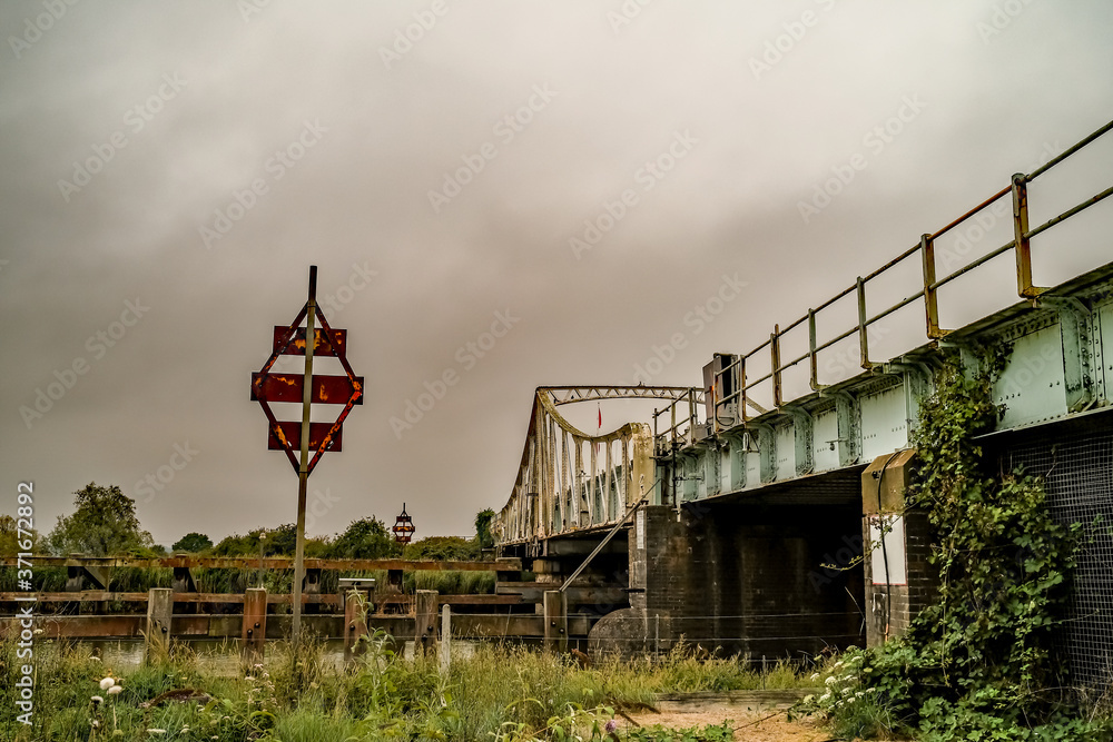 Waste ground next to the metal railway bridge in Norfolk
