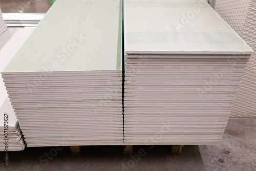 Valokuva Pallet with Drywall sheets plasterboard in the building warehouse store