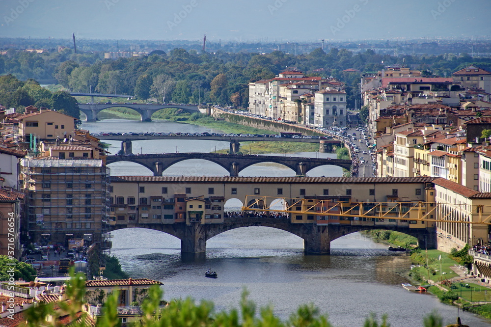 Aerial view of the Arno river and its bridges. Beautiful city landscape of Florence. 