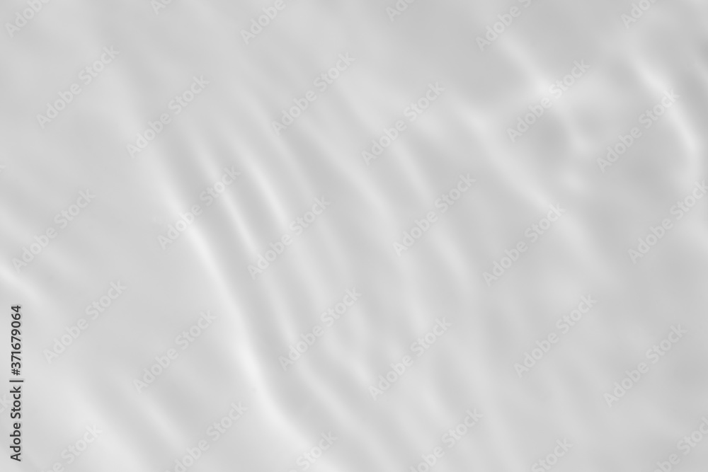 Closeup of desaturated transparent clear calm water surface texture with splashes and bubbles. Trendy abstract nature background. White-grey water waves in sunlight. Closeup of desaturated transparent clear calm water surface texture with splashes and bubbles. Trendy abstract nature background. White-grey water waves in sunlight.