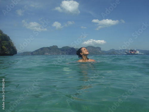 Tan Woman Relaxing In The Water