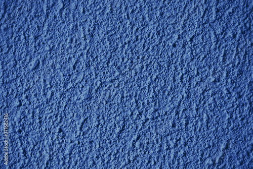 Rough unsmooth dark blue wall texture