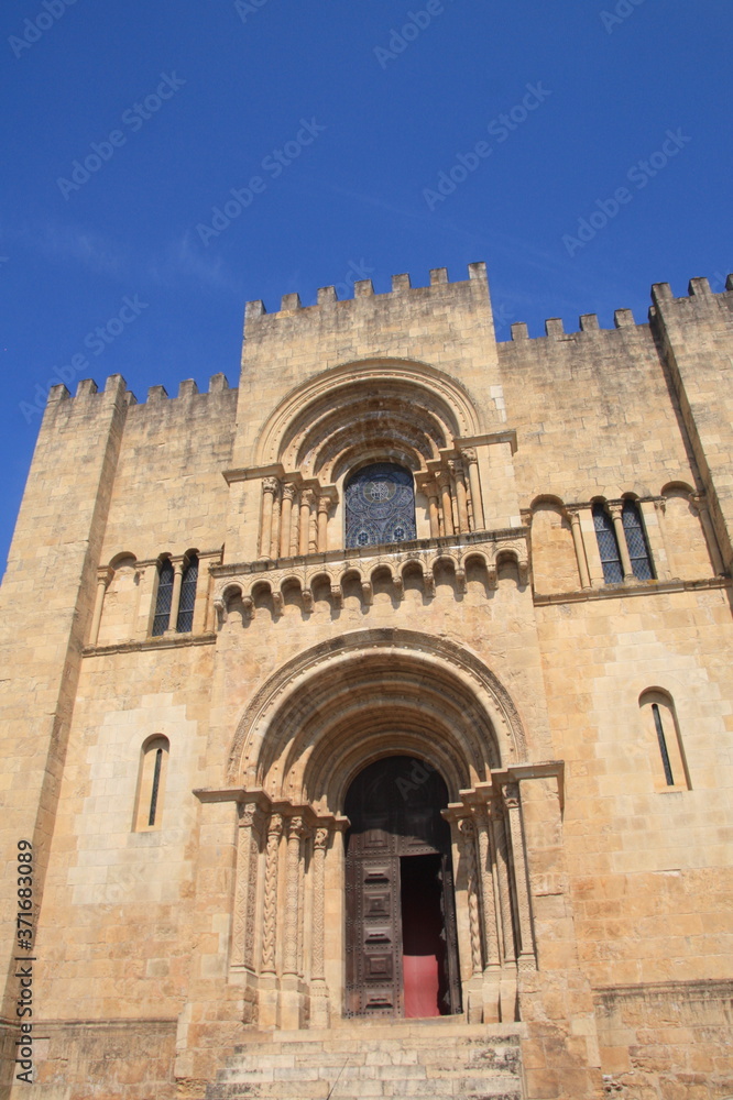 Principal facade of Se Velha, Santa Maria de Coimbra, the old Cathedral of Coimbra, Portugal.