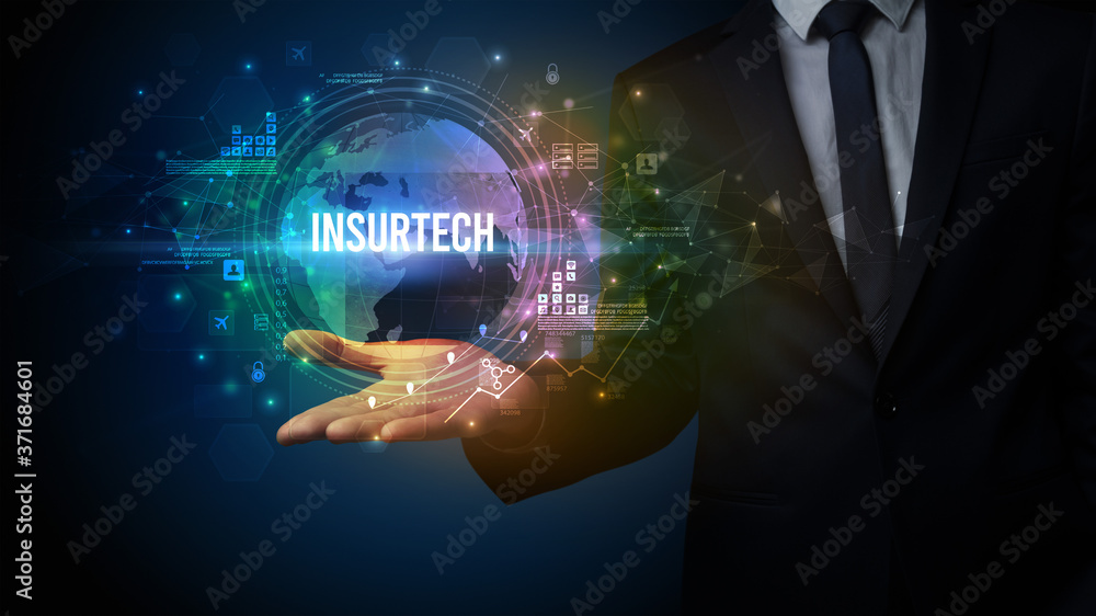 Fototapeta premium Elegant hand holding INSURTECH inscription, digital technology concept