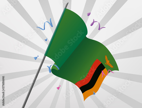 The celebratory flag of Zambia flies at height