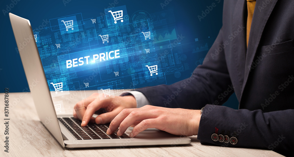 Businessman working on laptop with BEST PRICE inscription, online shopping concept Businessman working on laptop with BEST PRICE inscription, online shopping concept