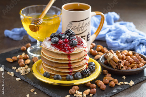 Breakfast with fruits, drinks, pancakes