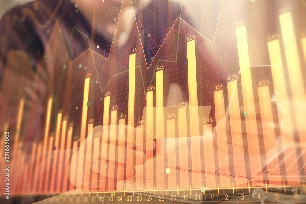 Double exposure of man's hands holding and using a phone and financial graph drawing. Analysis concept. Double exposure of man's hands holding and using a phone and financial graph drawing. Analysis concept.