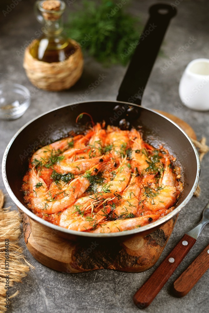 Fried shrimps in tomato sauce with garlic, dill and lemon juice. Healthly food. Fried shrimps in tomato sauce with garlic, dill and lemon juice. Healthly food.