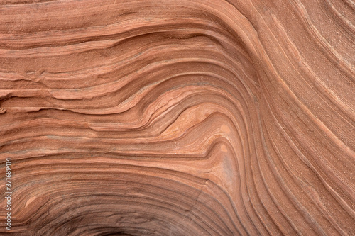 strange patterns in the sandstone of a side canyon of lake Powell, Arizona. Layered texture.