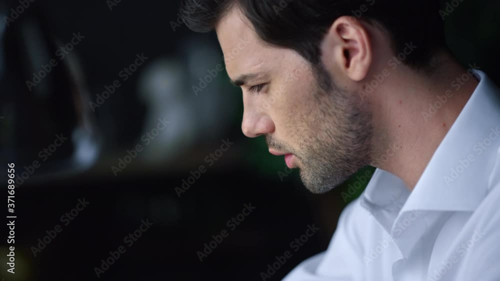Serious businessman portrait. Focused male employee working indoors Serious businessman portrait. Focused male employee working indoors