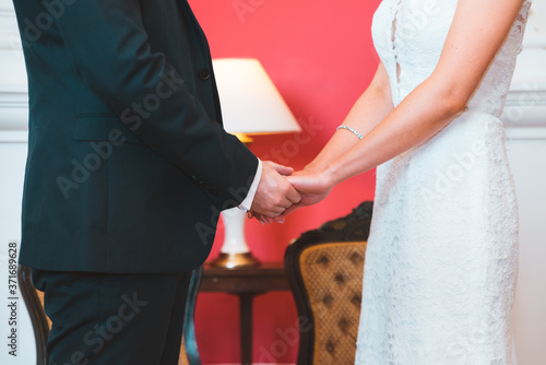 Married Couple Holding Hands During Service © Sussex Media