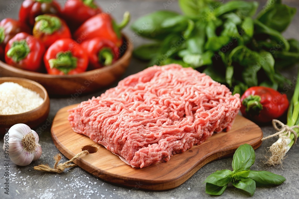 Minced meat, organic bell peppers, rice and spices for making stuffed peppers. Minced meat, organic bell peppers, rice and spices for making stuffed peppers.