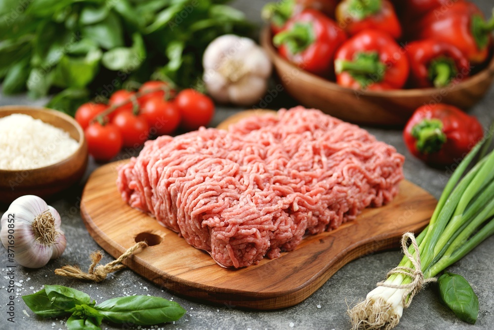 Minced meat, organic bell peppers, rice and spices for making stuffed peppers. Minced meat, organic bell peppers, rice and spices for making stuffed peppers.