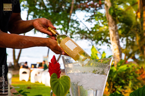 Serving wine in a Beach Hotel in Costa Rica at the Caribbean photo