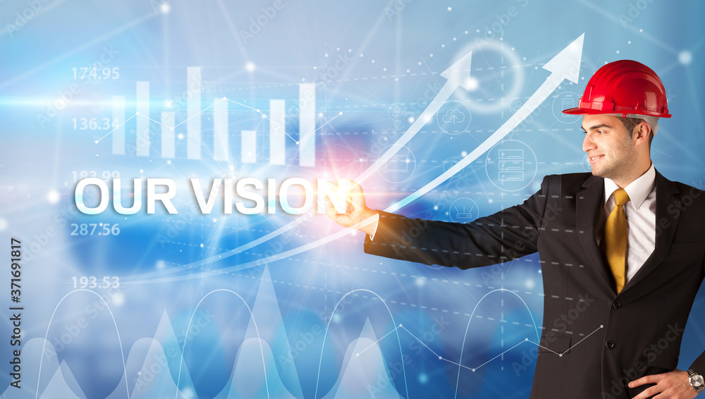 Young businessman with helmet drawing OUR VISION inscription, modern business technology concept Young businessman with helmet drawing OUR VISION inscription, modern business technology concept