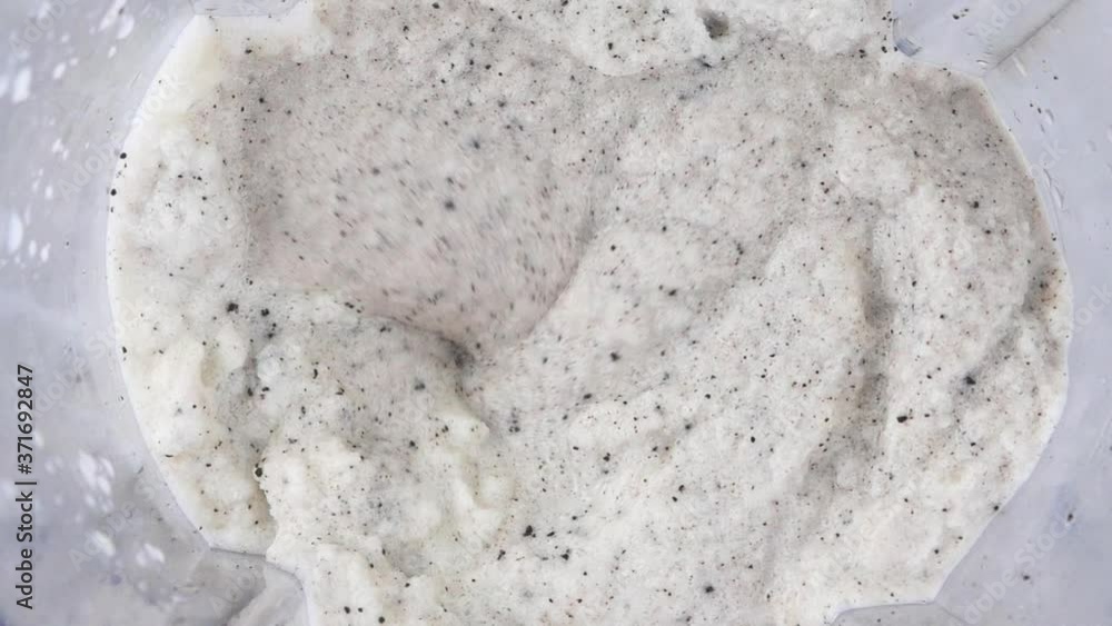 Blender Cookies & Cream Smoothie and mixing, slow motion Top view Food concept.
Blender Cookies & Cream Smoothie and mixing, slow motion Top view Food concept.