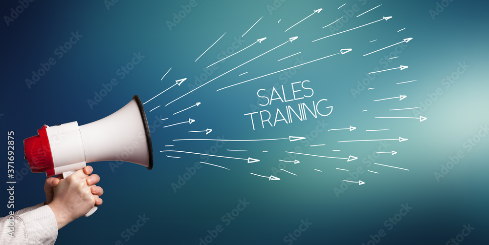 Young girl screaming to megaphone with SALES TRAINING inscription, shopping concept Young girl screaming to megaphone with SALES TRAINING inscription, shopping concept