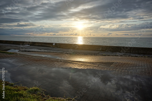 Sunset. Beautiful sunset at Japanese sea. Gold sea sunset. Picture Sea sunset.