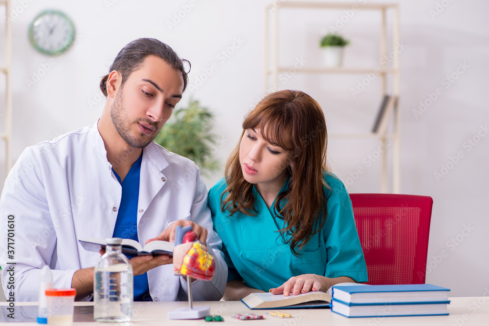 Two doctors colleagues working in the hospital Two doctors colleagues working in the hospital