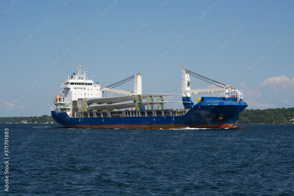 A large carrier boat on a river