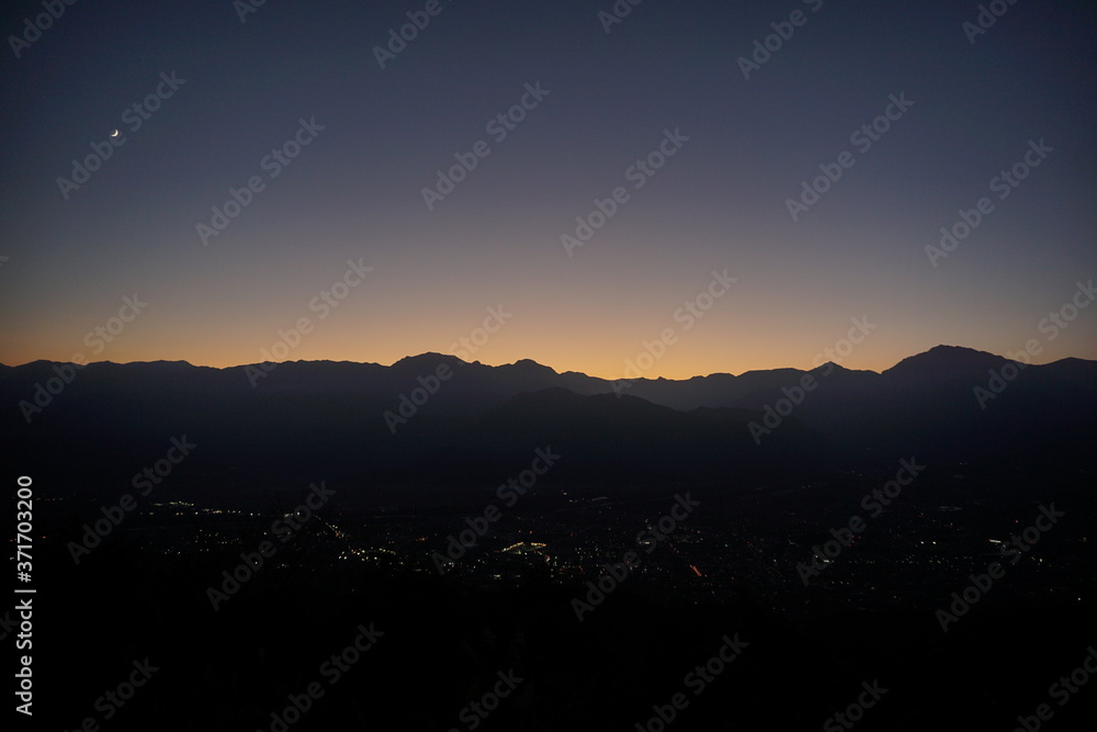 Naklejka premium view of mountain silhouette on twilight sky after sunset, Japanese alps, Hakuba, Japan