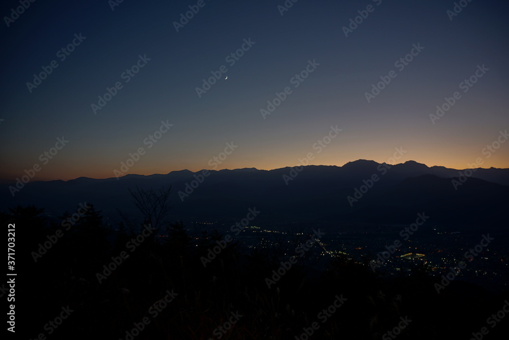 Naklejka premium view of mountain silhouette on twilight sky after sunset, Japanese alps, Hakuba, Japan