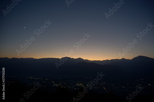 view of mountain silhouette on twilight sky after sunset, Japanese alps, Hakuba, Japan