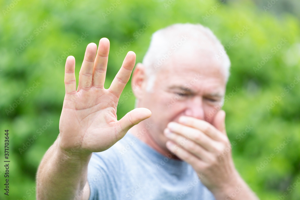 The sick person makes a gesture stop with his hand The sick person makes a gesture stop with his hand
