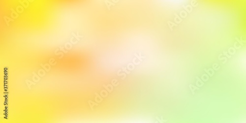 Light green, yellow vector blur texture.