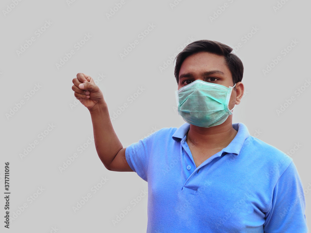 Man in Surgical face mask standing against corona virus Man in Surgical face mask standing against corona virus