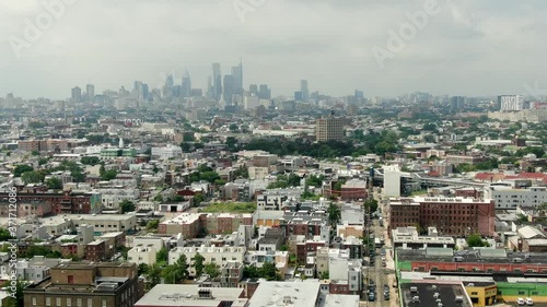 Wallpaper Mural Kensington and North Philadelphia neighborhoods with Philly skyline in distance, aerial establishing shot of poor communities, homes and housing projects, summer day Torontodigital.ca