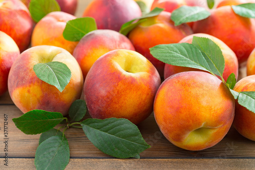 Ripe peaches on an old background