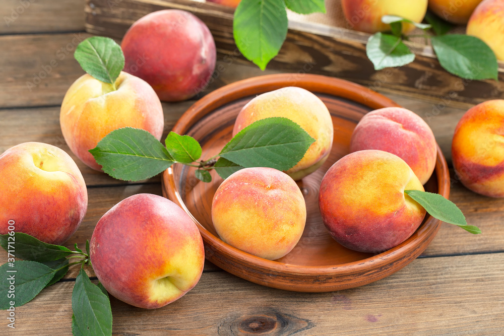 Ripe peaches on an old background Ripe peaches on an old background
