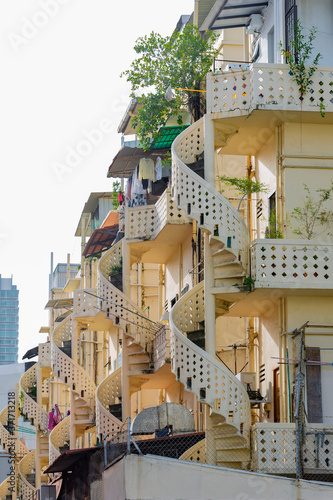 Photography A spiral staircase in a residential building in the Little India historic distri